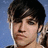 Pixelated image of a person with dark hair against blue background, surrounded by text fragments on black