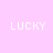 A static image with a light pink background displaying the word 'LUCKY' in white pixelated text across nine positions, partially cropped on the right side.