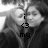 Pixelated grayscale image with text 'i is my' overlaid on a blurred background of indistinct shapes.