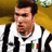 Static pixelated image of a soccer player in a black-and-white striped jersey with an Italian flag patch, set against a yellow background.