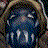 A pixelated image of a figure with white face paint, black eye makeup, and a ruffled collar, surrounded by repeated red text on a black background.