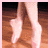 Pixelated image of a person's lower legs and feet in ballet shoes on wooden floor, with text overlays reading "Love to Dancel" and "Buddy Putty .com".