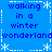 Blue background with repeated text "walking in a winter wonderland" and white snowflake symbols arranged in a pattern