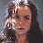 A 48x48 pixel buddy icon split into two frames showing a woman with long dark hair on the left and green text "OriginalIcons.com" on a dark green background on the right.