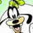 Animated cartoon character with black ears and yellow nose, wearing green bow tie, smiling against light green background.