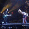 A sequence of animated frames showing a performer on stage with multiple musicians, captured in various poses and lighting conditions.