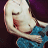 A contact sheet of three animated frames showing a shirtless man in blue shorts with visible belly, transitioning from holding his pants to standing still against a purple background, below which is text reading "Daron Malakian" and "SYSTEM OF A DOWN" on black.