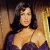 A pixelated image of a woman in a purple dress next to green text reading "Original Icons .com" on a dark background.