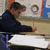 six shows a person at a desk with text elements: 'spider-man', 'doing', and 'math' in red letters with blue outlines, plus a question mark symbol