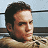 A 48x48 pixel buddy icon split into two frames showing a person in a beige sweater on the left and green text "OriginalIcons.com" on the right against a dark background.