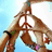 Pixelated image of two hands forming a peace sign against light blue background with partial text "Pege" on right.