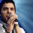 A person holding a microphone against a blue background, with green text reading 'david archuleta' on the right side.