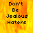 Pixelated text 'Don't Be Jealous Haters' on a fiery orange-yellow background with one gray