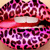 A circular icon with a pixelated lip shape in pink and purple tones, featuring a white horizontal band across the middle.