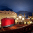 A pixelated static image shows a theater facade with a red marquee, illuminated windows, and a dark blue sky background.