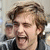 A pixelated image shows a person with light brown hair and a dark jacket on the left, next to bold white text 'LOL!' on black background.