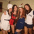 Group of five people in casual and chef attire posing together, with one person's face blurred.