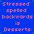 Blue background with pink text reading "Stressed spelled backwards is Desserts" repeated in a pattern, featuring small green dots scattered across the surface