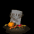 Animated contact sheet of a pixelated tombstone with pumpkin and ghost props, showing sequential frame changes against black background.