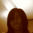 A static pixelated image shows a person with long brown hair against a warm-toned background, featuring light and dark brown gradients.