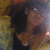 A person with dark hair and a black top appears in four showing slight head movement against a blurred background