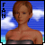 Pixelated avatar of a woman with short brown hair in strapless top against blue sky background, text "FAN" on left side.
