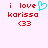 Red pixelated text 'i love karissa <33' with a cyan heart symbol replacing the word 'heart', displayed on a light pink background.