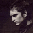 Pixelated profile of a person with dark hair against a dark background, next to green text reading 'Original Icons .com' on a solid green backdrop.