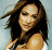 A 48x46 pixel animated buddy icon featuring a woman with long brown hair on the left and green text reading "Original Icons .com" on a dark green background to the right, displayed as a contact sheet of two frames.