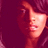 A pixelated image of a person with long dark hair and a red-toned background, showing three distinct facial expressions