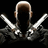 A figure with a bald head and dark clothing holds two silver handguns in crossed positions against a black background.