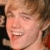 Static 50x50 pixel icon showing a close-up of a person's face with light brown hair and visible facial features including eyes, nose, mouth, and cheeks.