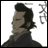 Pixelated anime-style character with dark hair and a high-collared dark garment against a white background, next to stylized text on a black background.