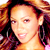 A 2x2 contact sheet of a pixelated animated icon featuring Beyoncé Knowles in two frames and CoolBuddy.com branding on the top-right frame, with gray transparency background.