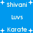 Blue background with white pixelated text and plus signs arranged in a pattern, showing repeated phrases and symbols