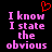 A static image with pink pixelated text reading "I know I state the obvious" on a black background, with a red pixelated heart symbol above the text.