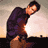 A pixelated animated sequence shows a person in dark clothing against light backgrounds, transitioning from leaning to lying down with closed eyes.