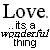 Pixelated black text on white background reads "Love. ..its a wonderful thing" with visible dithering and anti-aliasing artifacts.