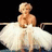 Pixelated image of a blonde woman in a white dress sitting on a railing with the word 'Princess' overlaid.