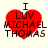 Red heart-shaped icon with 'I LUV MICHAEL THOMAS' text, showing pixelated variations across four views.