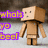 Pixelated character with blocky brown hair and beige face stands against gradient background with purple-yellow text reading 'whats yo beel'.