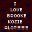 Dark red background with scattered dark blue hearts, white pixelated text reading "I LOVE BROOKE KOZIE ALOT!!!!!!!!" in two vertical