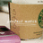 A static image shows a light brown rectangular object with white text and green accents, partially obscured by surrounding elements.