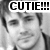 Black-and-white pixelated image of a person with short hair, showing two side-by-side views where the left view has text overlay and the right does not.