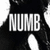 Black-and-white image of a cat with large white eyes and the text 'NUMB' in bold, blocky letters overlaid on its face.