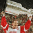 A pixelated image shows a person in red and white clothing holding up a large light-colored object, with red text reading "Just Like Stevie y." on the right.