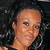 A person with curly dark hair and large hoop earrings appears in three distinct poses against a black background.