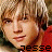 Pixelated static image of a person's face with red clothing and visible text "JESSE" at the bottom, rendered in low-resolution 256x256 pixels.