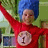 Two side-by-side animated frames of a character with blue hair and red long-sleeve shirt, each holding up arms in a celebratory pose against a green background.