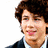 Pixelated image of a person with curly brown hair and dark clothing, surrounded by blue text blocks on white background.